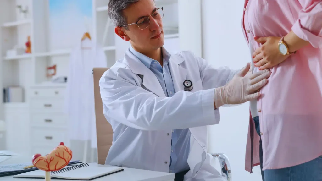 Doctor examining a patient during a consultation for digestive health evaluation and gastrointestinal treatment options