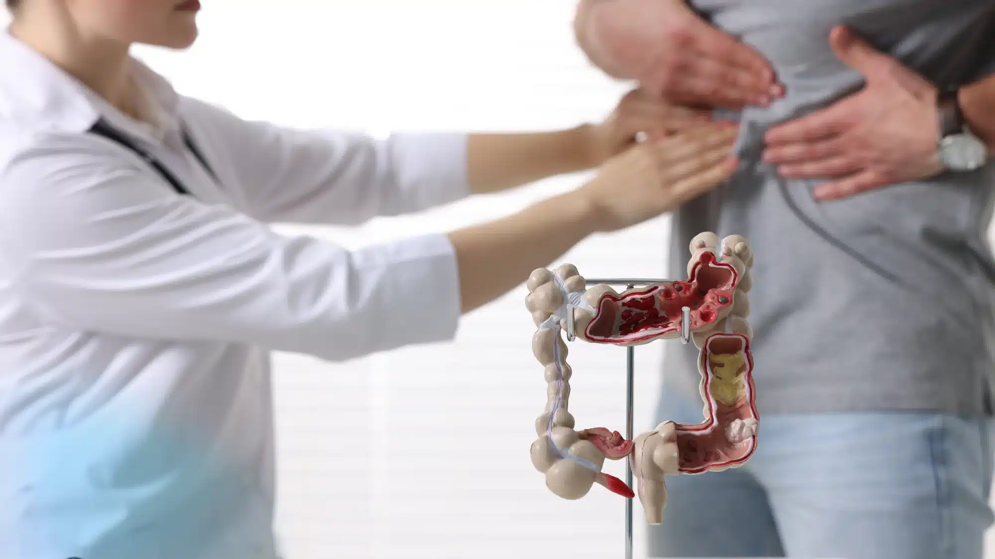 Doctor consulting patient about GERD, IBS, and digestive health issues during medical visit